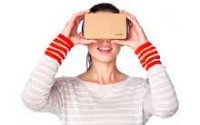 A Google Cardboard viewer held to the face.